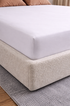 close up of fitted corner of 100 percent white bamboo bedsheet