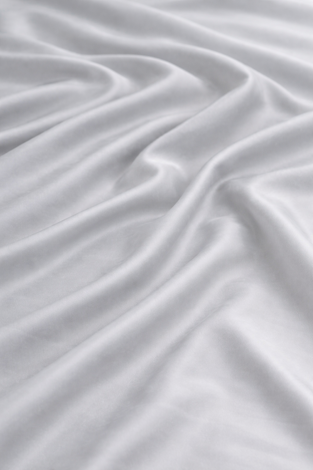 Close-up of grey 100% bamboo viscose duvet cover fabric showing a silky finish