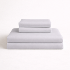 Folded light grey complete bamboo bed linen set. 4 pieces included in complete set: duvet cover, 1 bedsheet and 2 pillowcases