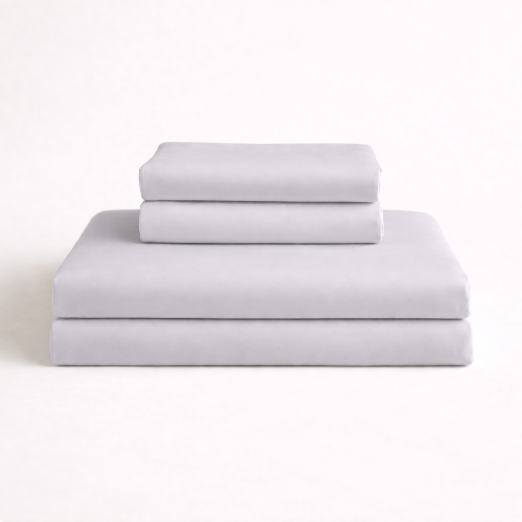 Folded light grey complete bamboo bed linen set. 4 pieces included in complete set: duvet cover, 1 bedsheet and 2 pillowcases