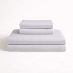 Folded light grey complete bamboo bed linen set: Includes fitted sheet, duvet cover and two pillowcases