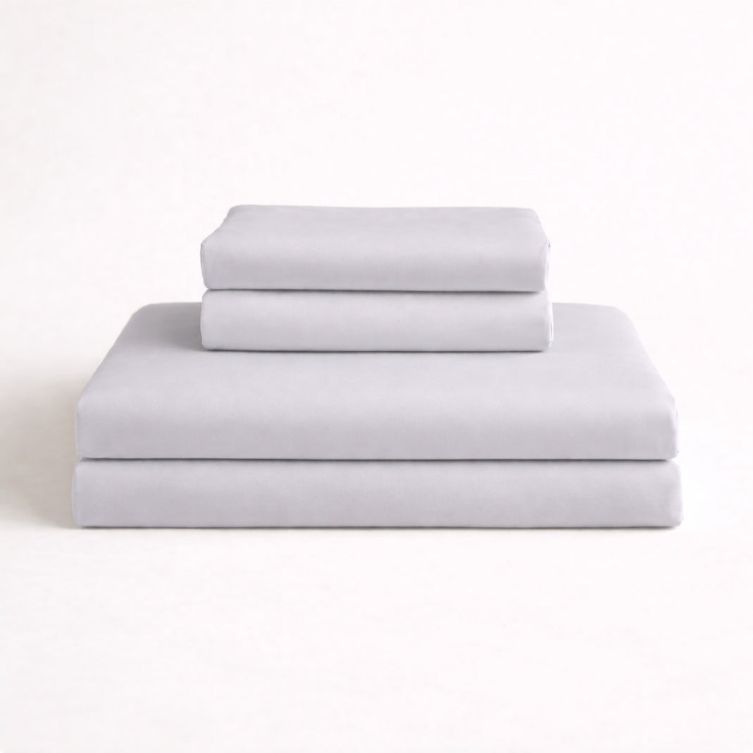 Folded light grey complete bamboo bed linen set: Includes fitted sheet, duvet cover and two pillowcases